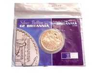Pre-Owned, 2001 Two Pound One Ounce Silver Britannia, sealed in Royal Mint descriptive card, Package scruffy & coin has 2 dark spots